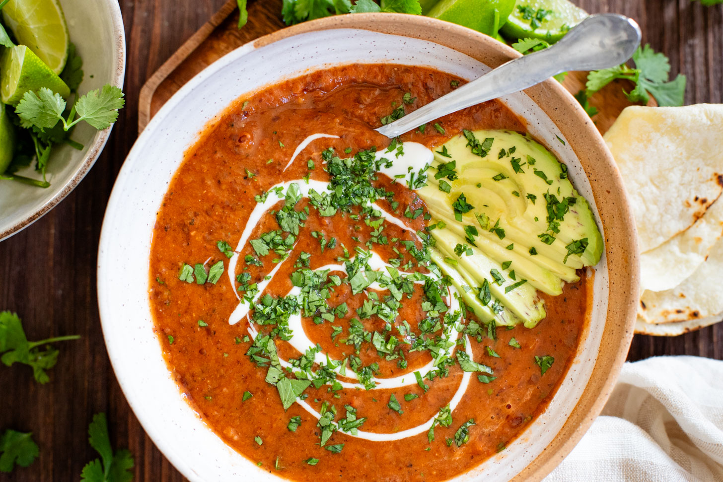 This Smoky Black Bean Soup is smooth, vegan and super simple. Perfect for meal prep and ready in less than an hour | ThisSavoryVegan.com #thissavoryvegan #vegansoup #easysouprecipes