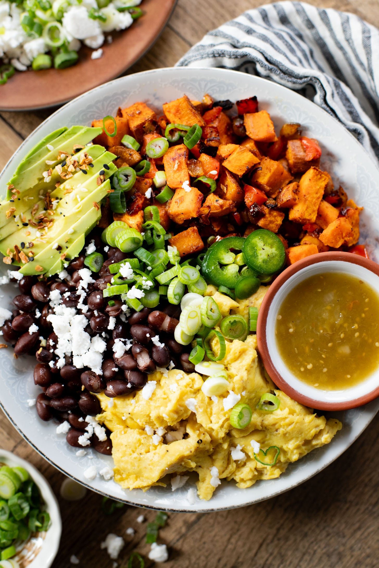 These Vegan Breakfast Bowls are healthy & delicious. Made with Just eggs, roasted sweet potatoes, black beans & avocado | ThisSavoryVegan.com #thissavoryvegan #veganbreakfastrecipes #healthybreakfast