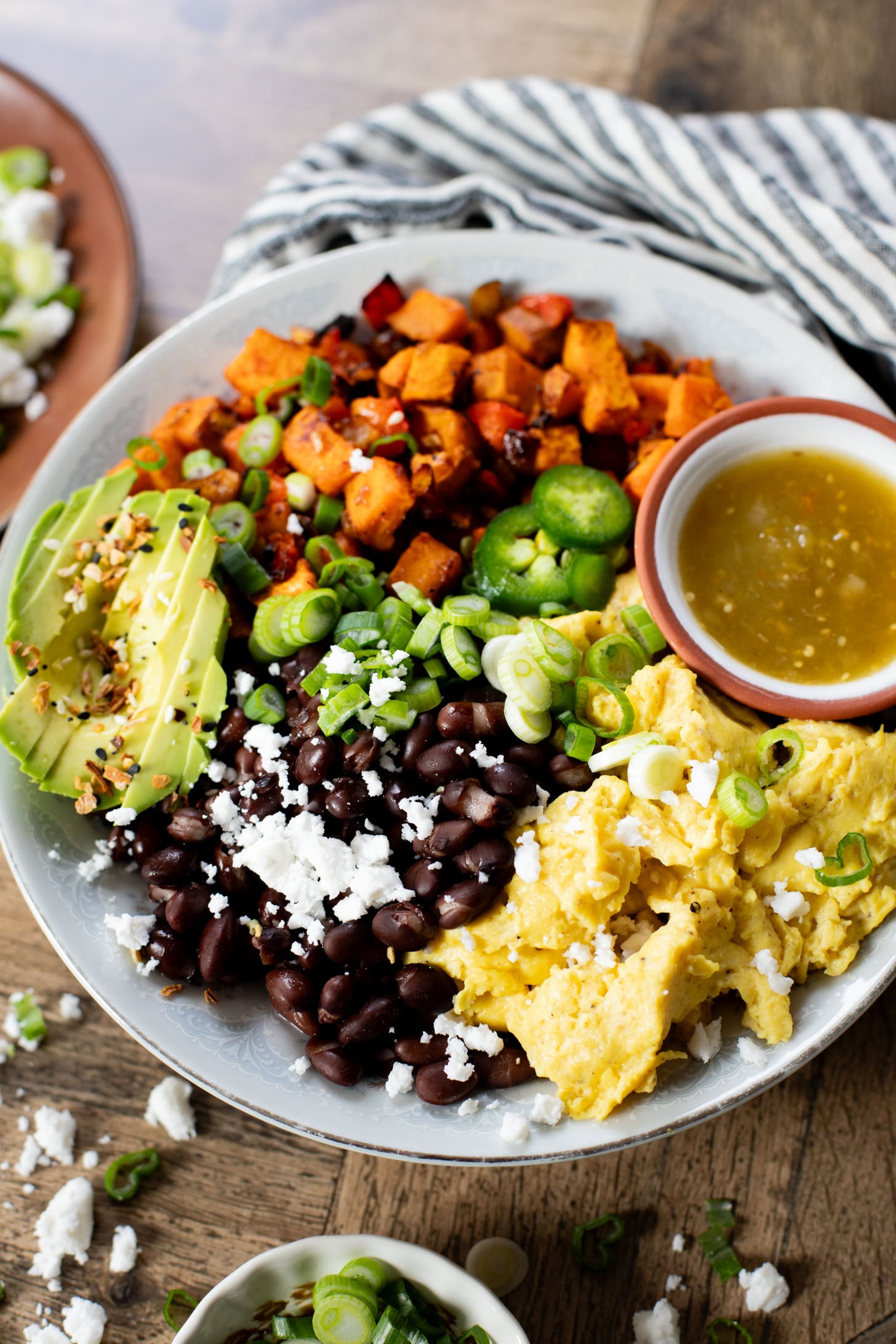 These Vegan Breakfast Bowls are healthy & delicious. Made with Just eggs, roasted sweet potatoes, black beans & avocado | ThisSavoryVegan.com #thissavoryvegan #veganbreakfastrecipes #healthybreakfast