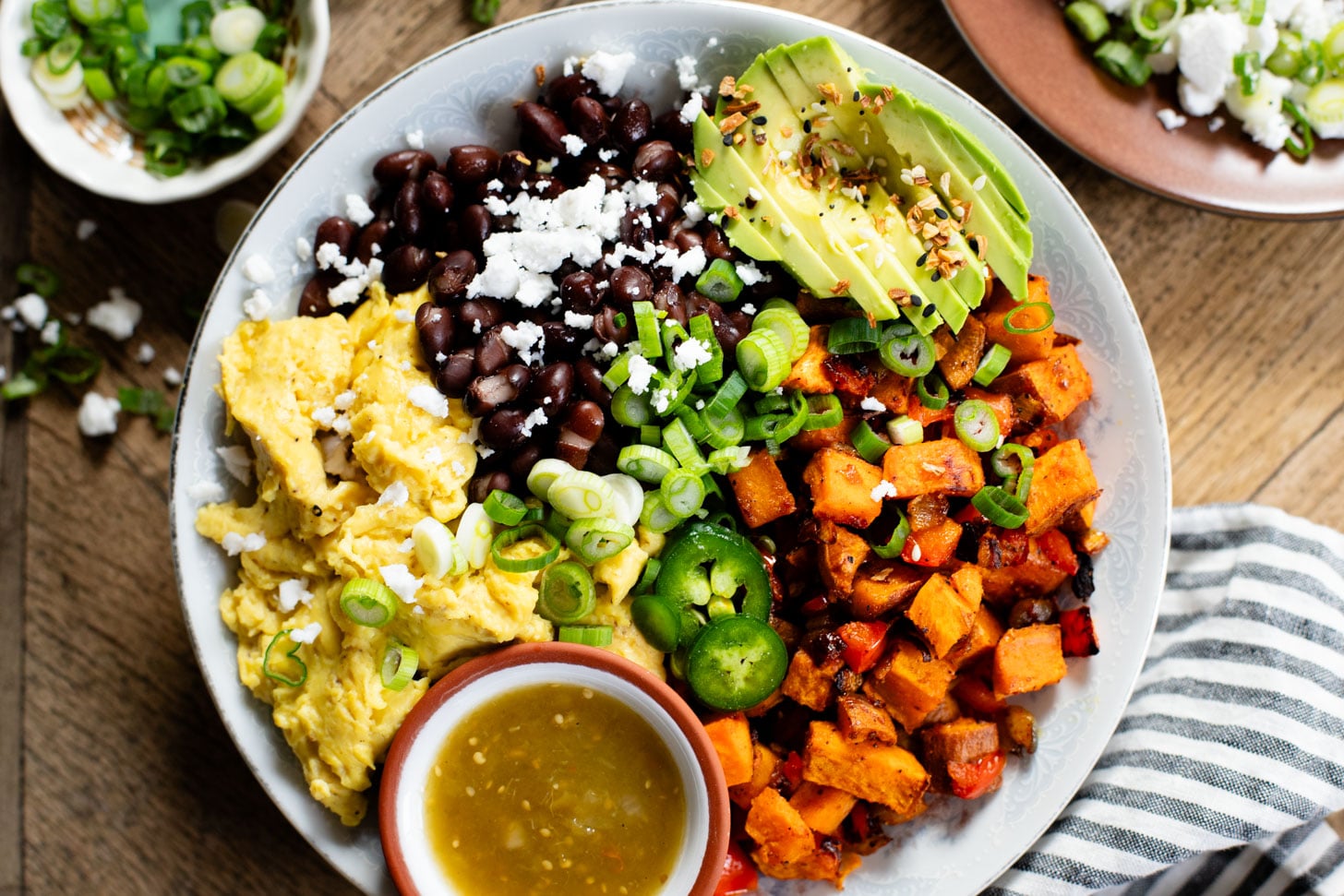 These Vegan Breakfast Bowls are healthy & delicious. Made with Just eggs, roasted sweet potatoes, black beans & avocado | ThisSavoryVegan.com #thissavoryvegan #veganbreakfastrecipes #healthybreakfast