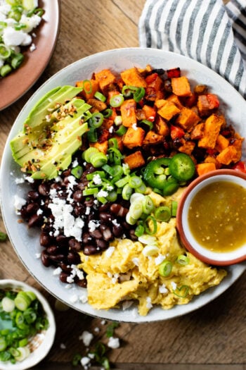 These Vegan Breakfast Bowls are healthy & delicious. Made with Just eggs, roasted sweet potatoes, black beans & avocado | ThisSavoryVegan.com #thissavoryvegan #veganbreakfastrecipes #healthybreakfast