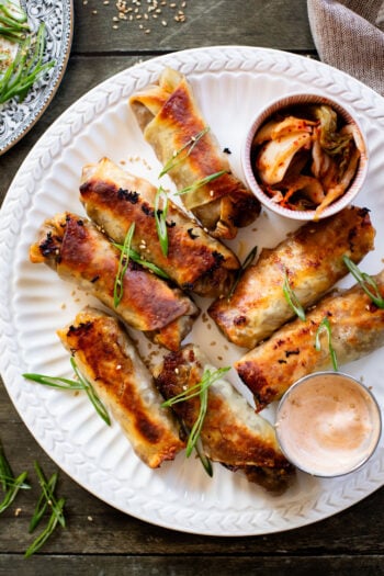 These Vegan Korean Beef Egg Rolls are the perfect party appetizer! Baked until crispy and served with sriracha mayo on the side for dipping | ThisSavoryVegan.com #thissavoryvegan #veganeggrolls #veganpartyfood