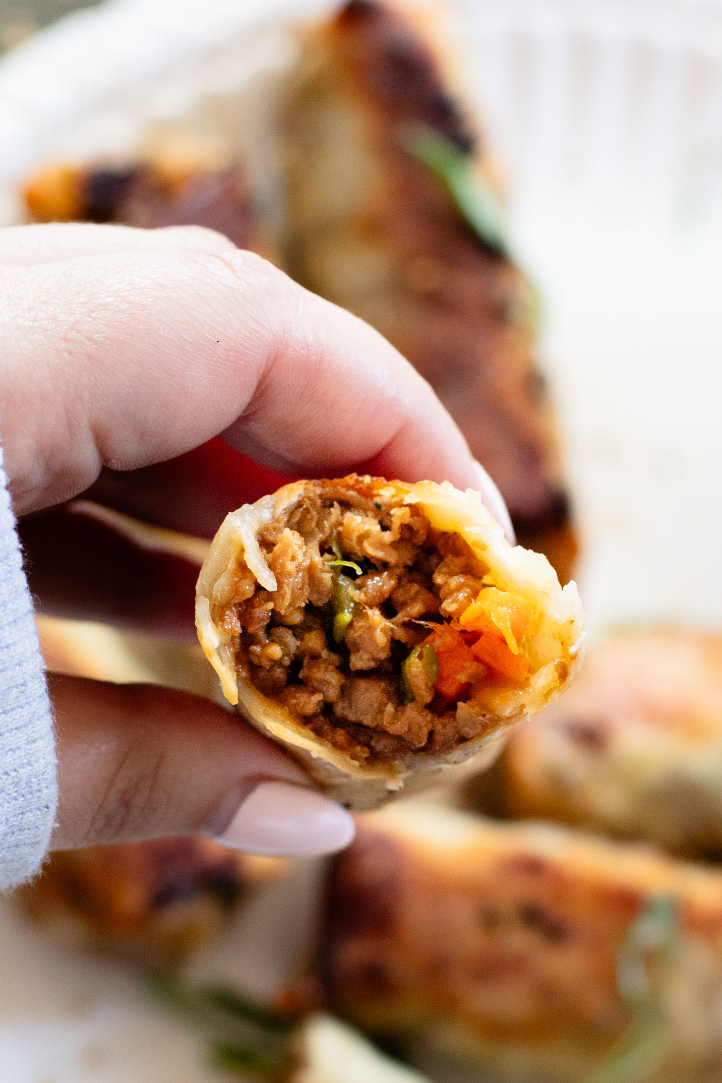 These Vegan Korean Beef Egg Rolls are the perfect party appetizer! Baked until crispy and served with sriracha mayo on the side for dipping | ThisSavoryVegan.com #thissavoryvegan #veganeggrolls #veganpartyfood