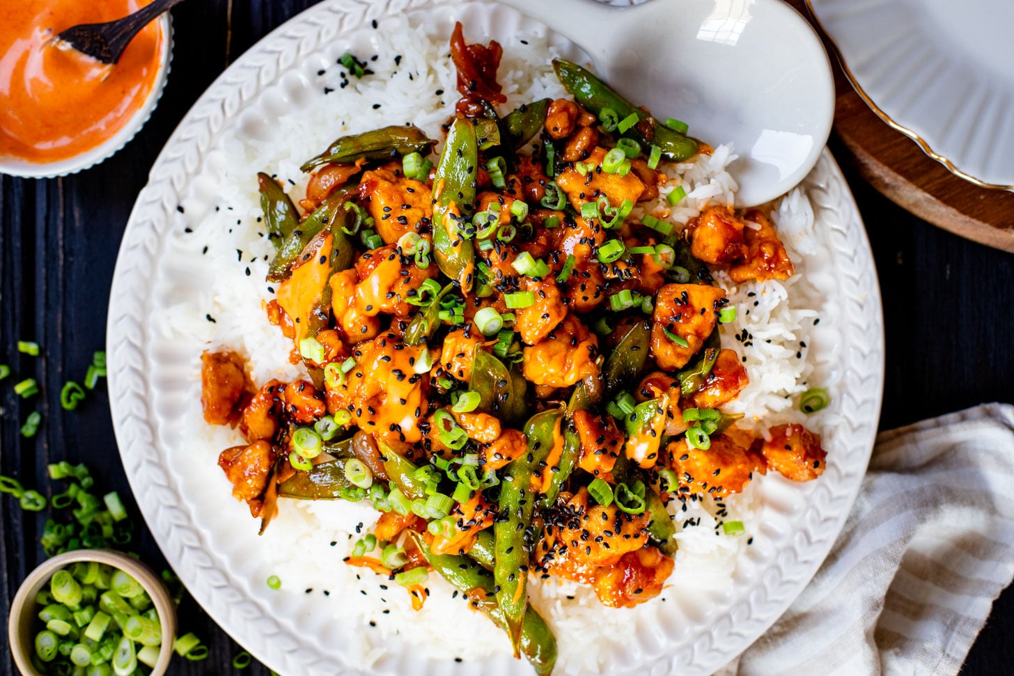 This Gochujang Tofu & Snap Peas recipe has crispy tofu & snap peas tossed in a tasty gochujang sauce. Served over rice with spicy mayo | ThisSavoryVegan.com #thissavoryvegan #crispytofu #veganasianinspired