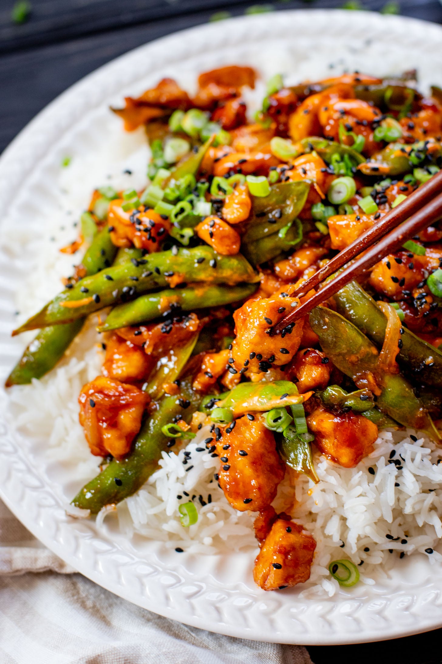 This Gochujang Tofu & Snap Peas recipe has crispy tofu & snap peas tossed in a tasty gochujang sauce. Served over rice with spicy mayo | ThisSavoryVegan.com #thissavoryvegan #crispytofu #veganasianinspired