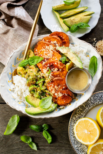 This Harvest Bowl with Maple Dijon Dressing is layered with rice, roasted sweet potatoes, crispy brussels sprouts, almond breadcrumbs & a tangy dressing | ThisSavoryVegan.com #thissavoryvegan #harvestbowl #winterrecipes