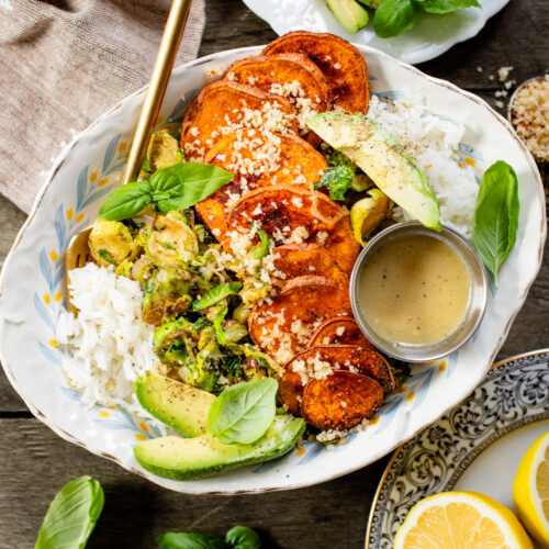 This Harvest Bowl with Maple Dijon Dressing is layered with rice, roasted sweet potatoes, crispy brussels sprouts, almond breadcrumbs & a tangy dressing | ThisSavoryVegan.com #thissavoryvegan #harvestbowl #winterrecipes