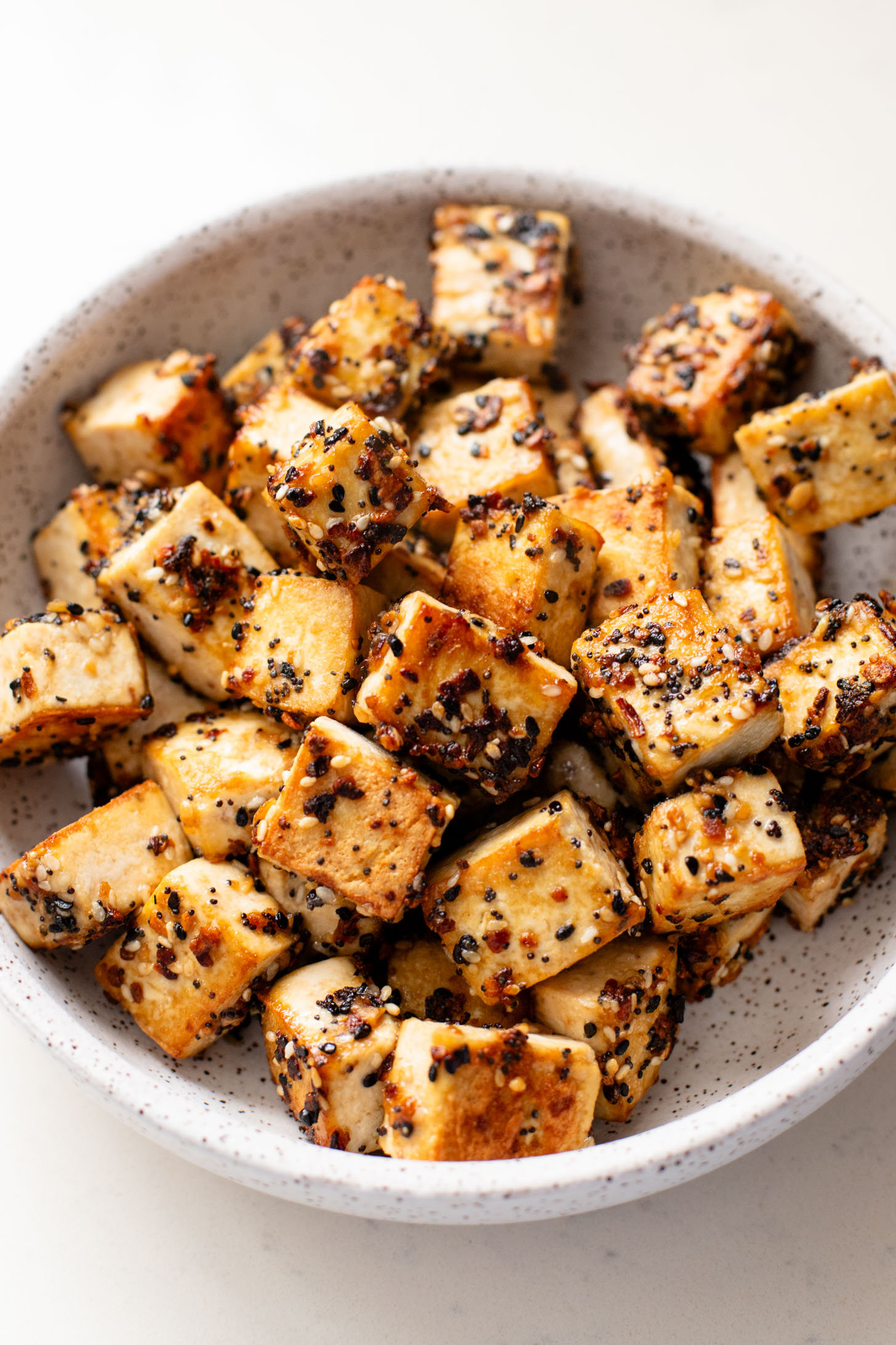 This Red Curry Peanut Soup with Sesame Crusted Tofu is made with a coconut broth, filled with veggies and finished with crispy tofu | ThisSavoryVegan.com #thissavoryvegan #tofurecipes #peanutsoup
