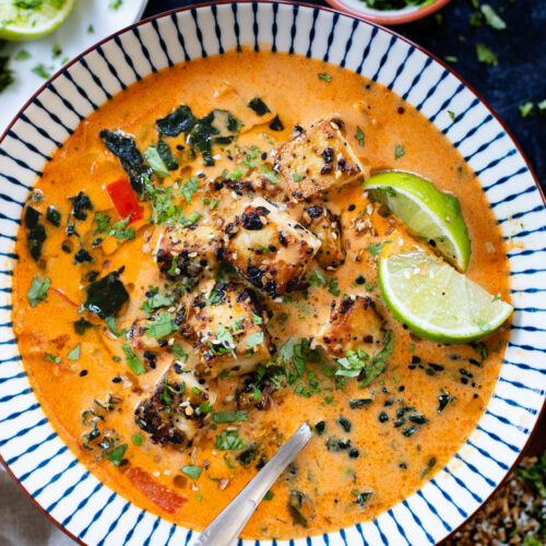 This Red Curry Peanut Soup with Sesame Crusted Tofu is made with a coconut broth, filled with veggies and finished with crispy tofu | ThisSavoryVegan.com #thissavoryvegan #tofurecipes #peanutsoup