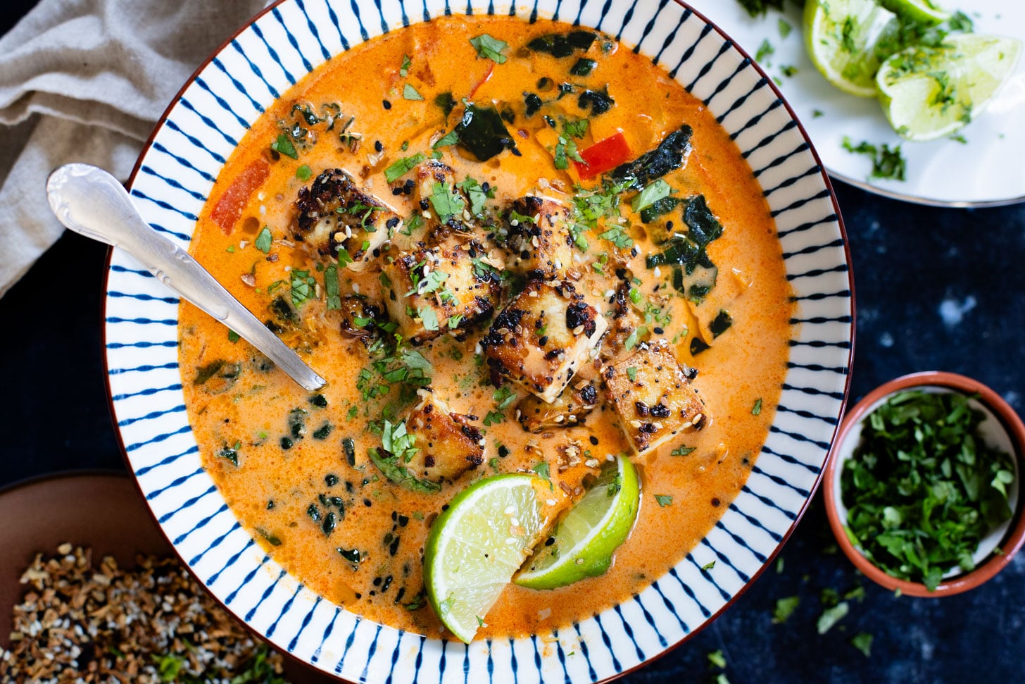 This Red Curry Peanut Soup with Sesame Crusted Tofu is made with a coconut broth, filled with veggies and finished with crispy tofu | ThisSavoryVegan.com #thissavoryvegan #tofurecipes #peanutsoup