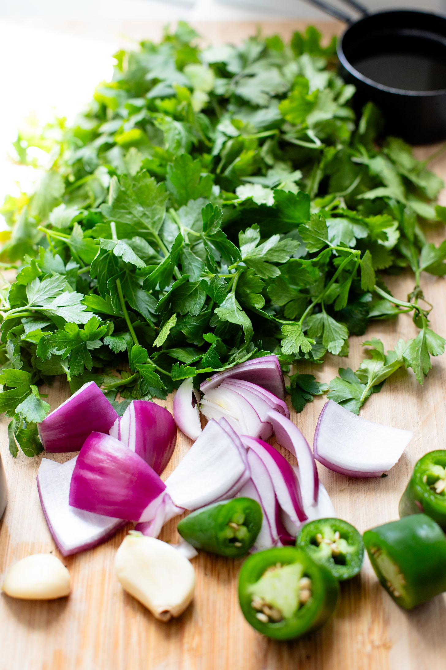 This Roasted Cauliflower with Chimichurri Rice is a flavor packed meal! Cauliflower & chickpeas seasoned and roasted until crispy over herby rice | ThisSavoryVegan.com #chimichurrirecipe #roastedcauliflower #veggiedinner