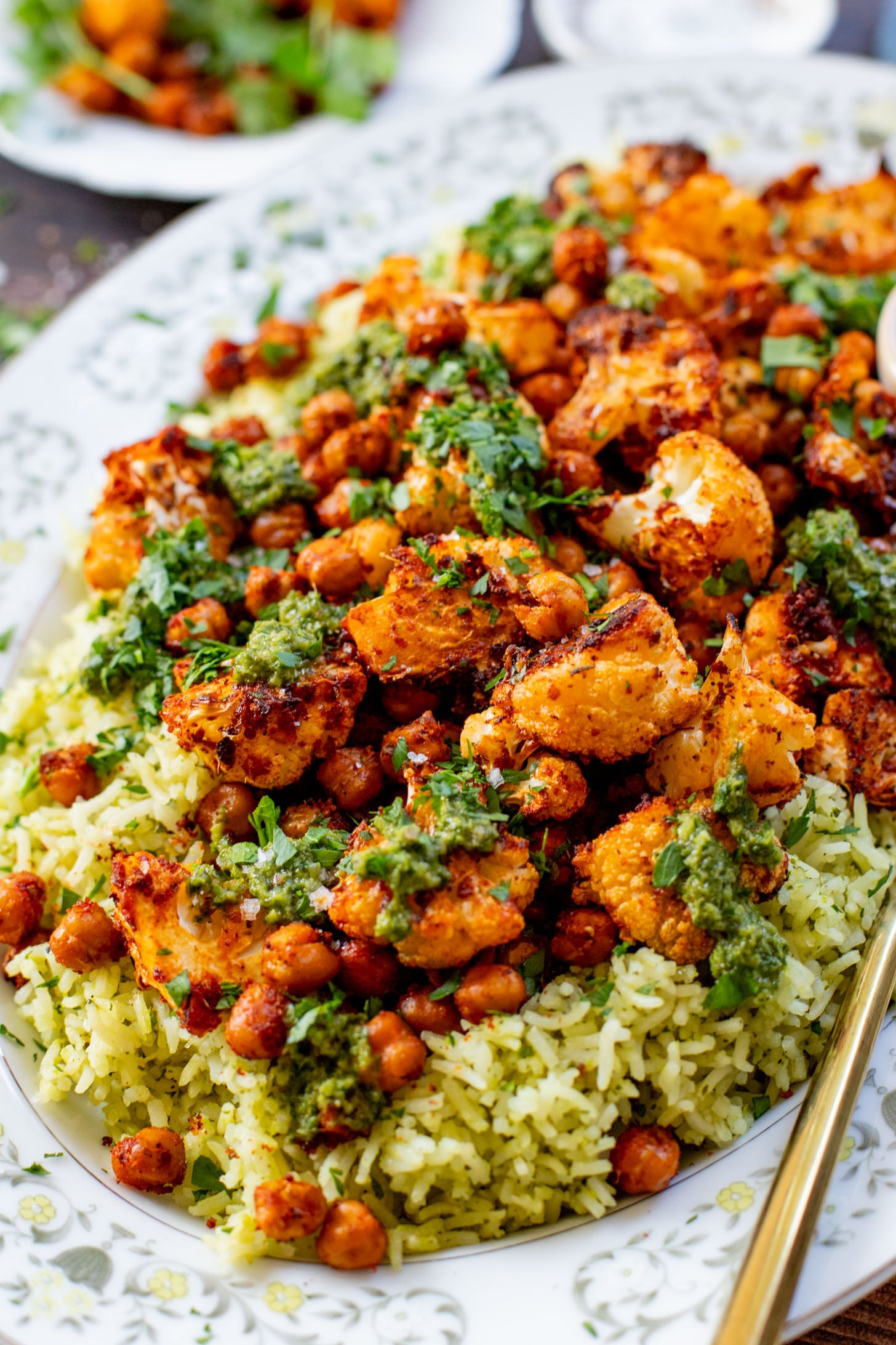 This Roasted Cauliflower with Chimichurri Rice is a flavor packed meal! Cauliflower & chickpeas seasoned and roasted until crispy over herby rice | ThisSavoryVegan.com #chimichurrirecipe #roastedcauliflower #veggiedinner