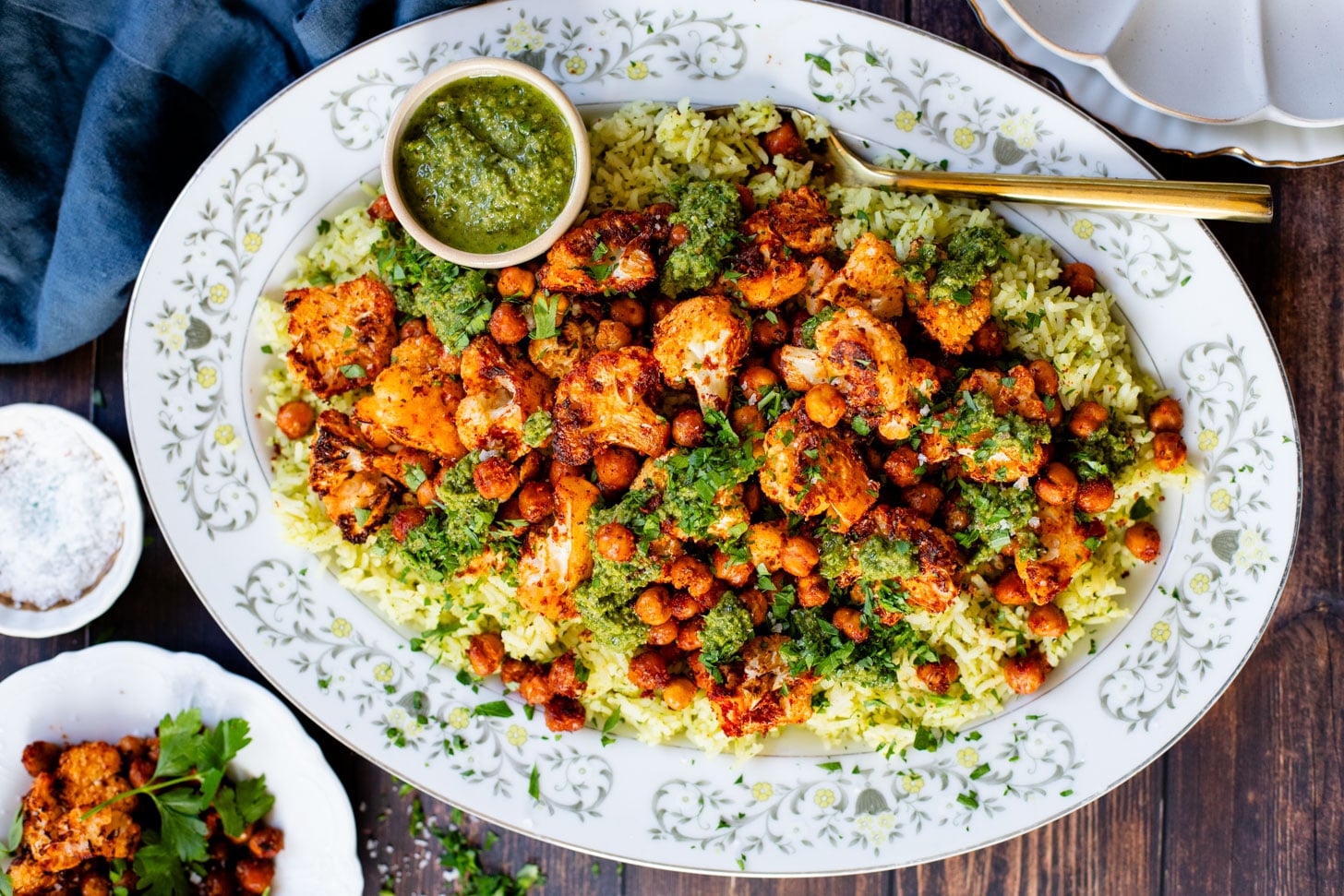 This Roasted Cauliflower with Chimichurri Rice is a flavor packed meal! Cauliflower & chickpeas seasoned and roasted until crispy over herby rice | ThisSavoryVegan.com #chimichurrirecipe #roastedcauliflower #veggiedinner