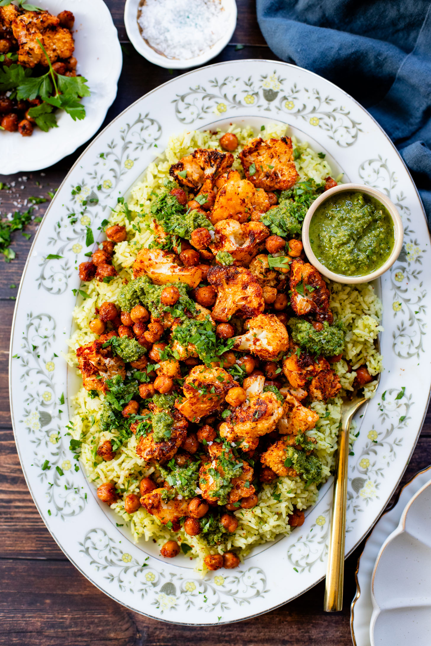 This Roasted Cauliflower with Chimichurri Rice is a flavor packed meal! Cauliflower & chickpeas seasoned and roasted until crispy over herby rice | ThisSavoryVegan.com #chimichurrirecipe #roastedcauliflower #veggiedinner