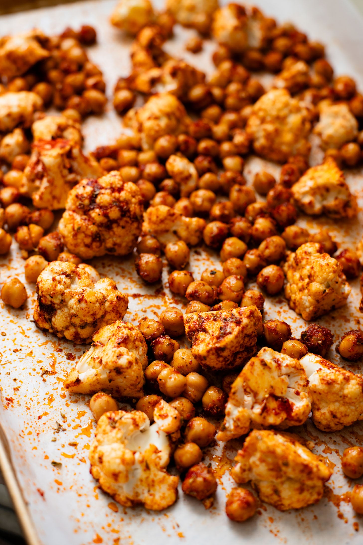 This Roasted Cauliflower with Chimichurri Rice is a flavor packed meal! Cauliflower & chickpeas seasoned and roasted until crispy over herby rice | ThisSavoryVegan.com #chimichurrirecipe #roastedcauliflower #veggiedinner