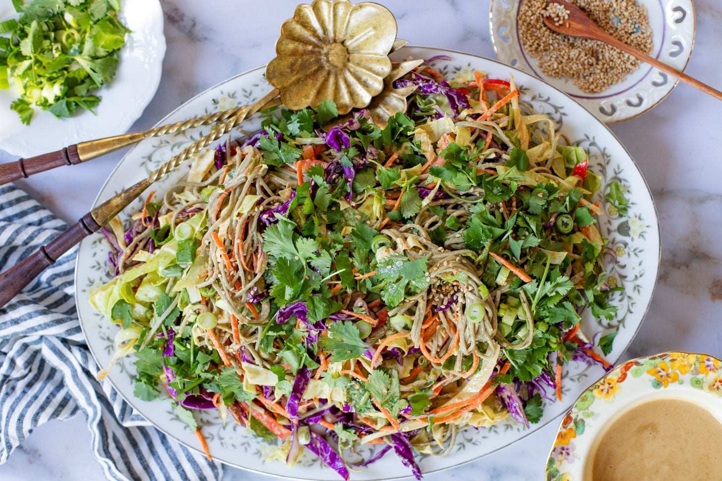 This Cold Peanut Noodle Salad is loaded with crunchy veggies, tender soba noodles and the BEST peanut sauce you've ever had | ThisSavoryVegan.com #thissavoryvegan #coldnoodles #peanutsalad
