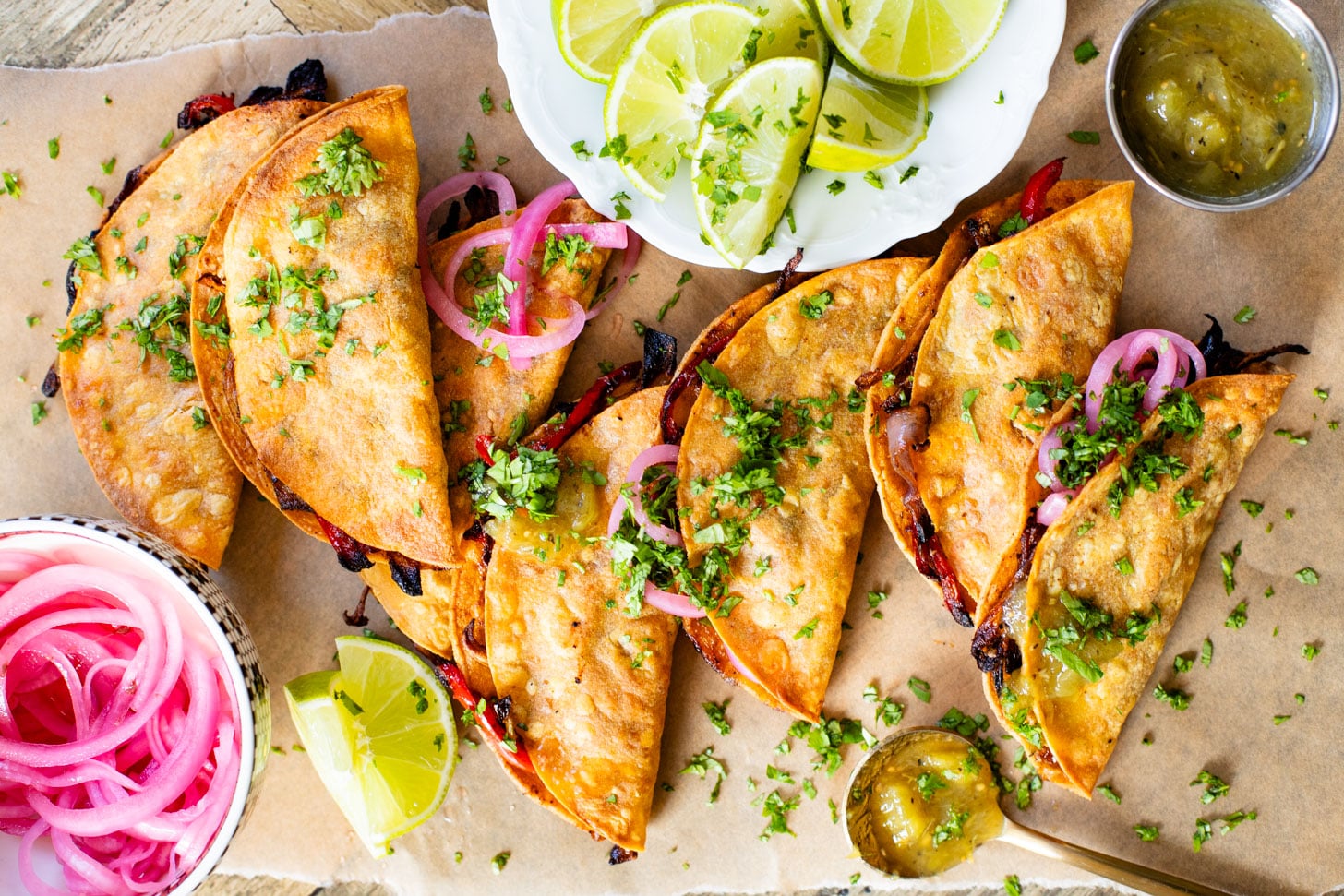 These Crispy Oyster Mushroom Tacos are a veggie dream! Roasted veggies are layered in corn tortillas & baked until crispy. Taco Tuesday goals | ThisSavoryVegan.com #thissavoryvegan #vegantacos #mushroomtacos