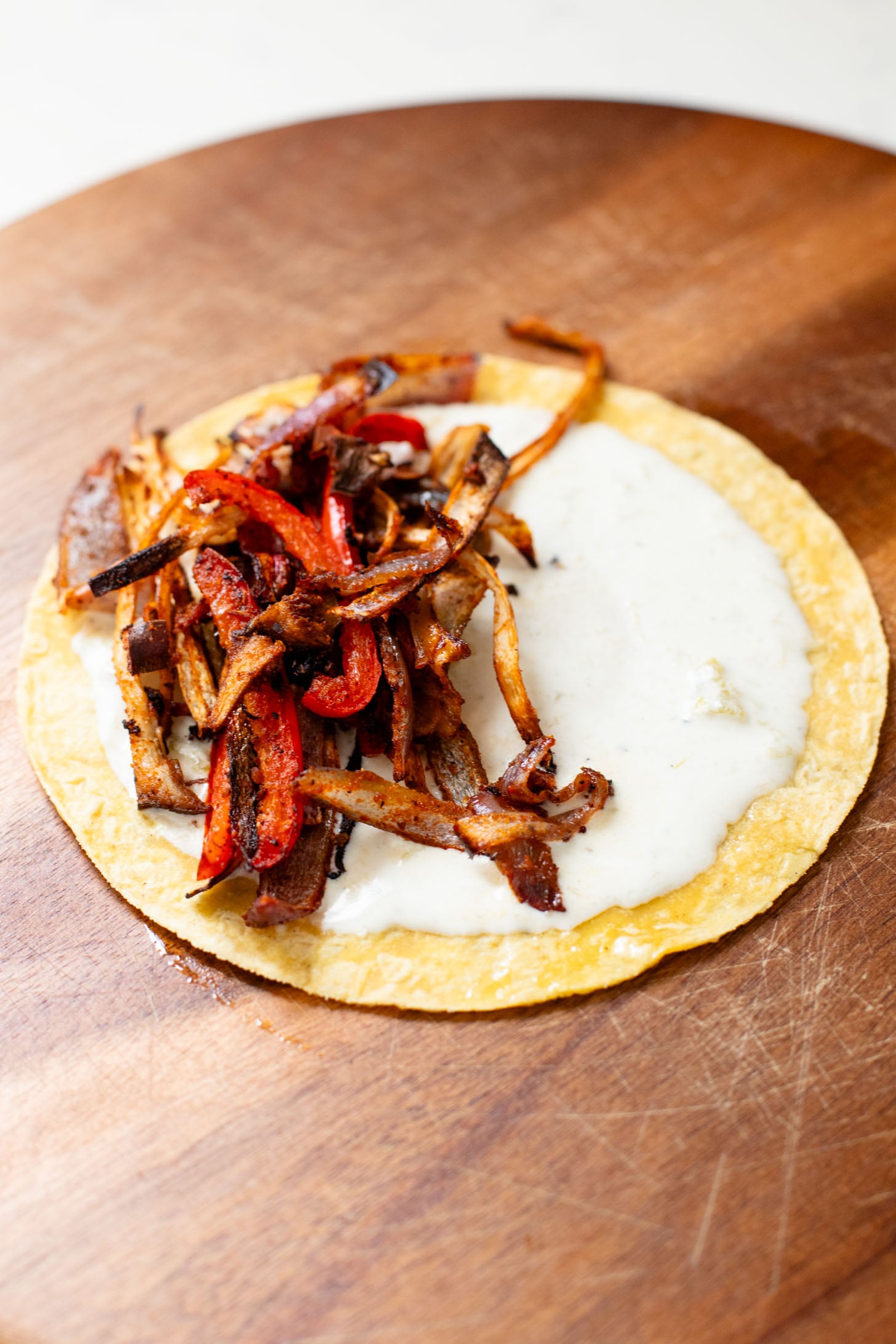 These Crispy Oyster Mushroom Tacos are a veggie dream! Roasted veggies are layered in corn tortillas & baked until crispy. Taco Tuesday goals | ThisSavoryVegan.com #thissavoryvegan #vegantacos #mushroomtacos