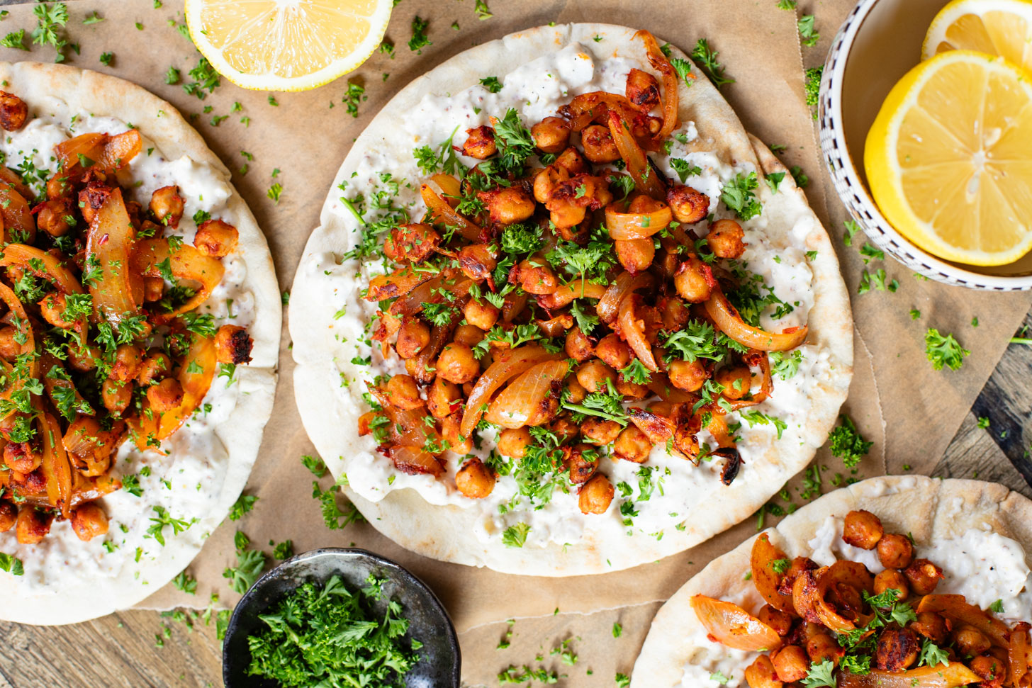 These Harissa Chickpea Pitas are layered with a lemon vegan feta sauce and crispy chickpeas cooked in a delicious harissa sauce | ThisSavoryVegan.com #pitasandwich #easyveganlunch #lunchideas