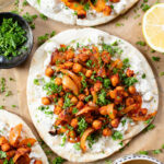 These Harissa Chickpea Pitas are layered with a lemon vegan feta sauce and crispy chickpeas cooked in a delicious harissa sauce | ThisSavoryVegan.com #pitasandwich #easyveganlunch #lunchideas