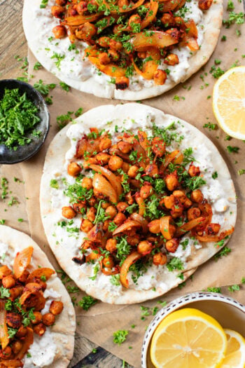 These Harissa Chickpea Pitas are layered with a lemon vegan feta sauce and crispy chickpeas cooked in a delicious harissa sauce | ThisSavoryVegan.com #pitasandwich #easyveganlunch #lunchideas