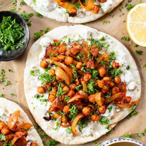 These Harissa Chickpea Pitas are layered with a lemon vegan feta sauce and crispy chickpeas cooked in a delicious harissa sauce | ThisSavoryVegan.com #pitasandwich #easyveganlunch #lunchideas