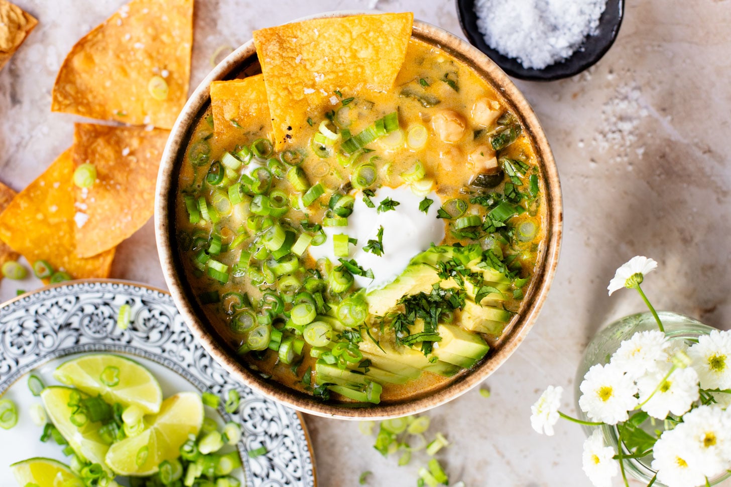 This simple, one-pot White Chickpea Chili is creamy & delicious. The perfect bowl of coziness to serve up on a cold day - don't forget the tortillas chips | ThisSavoryVegan.com #thissavoryvegan #veganchili #chickpearecipes