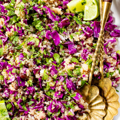This Black Bean Quinoa Salad is filled with crunchy veggies, a light lime dressing, black beans and chilled quinoa. The perfect lunch or dinner | ThisSavoryVegan.com