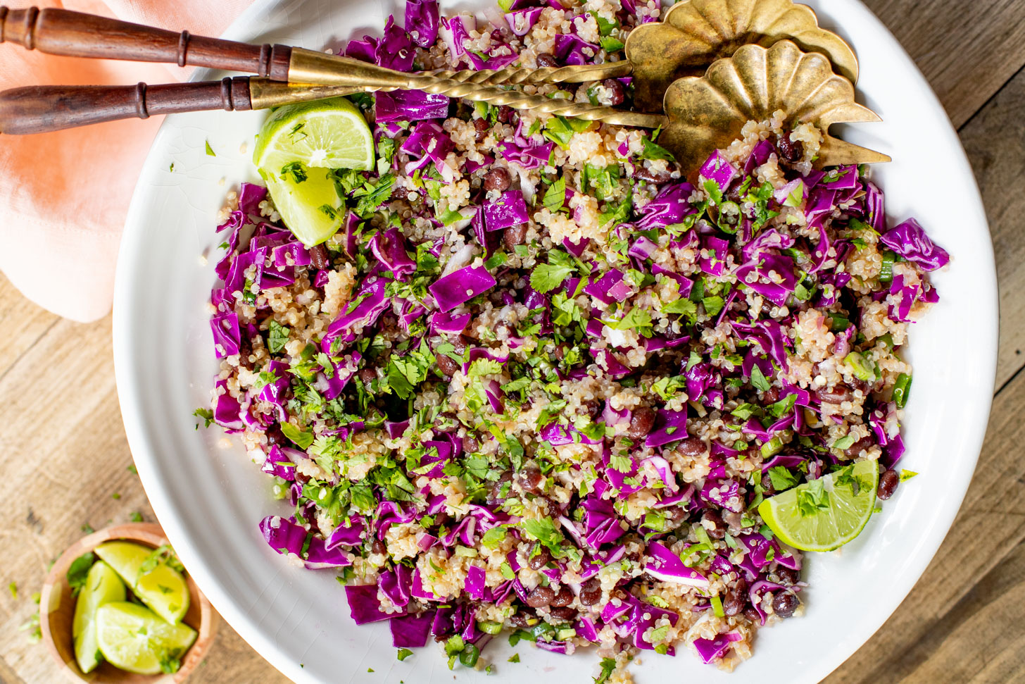 This Black Bean Quinoa Salad is filled with crunchy veggies, a light lime dressing, black beans and chilled quinoa. The perfect lunch or dinner | ThisSavoryVegan.com