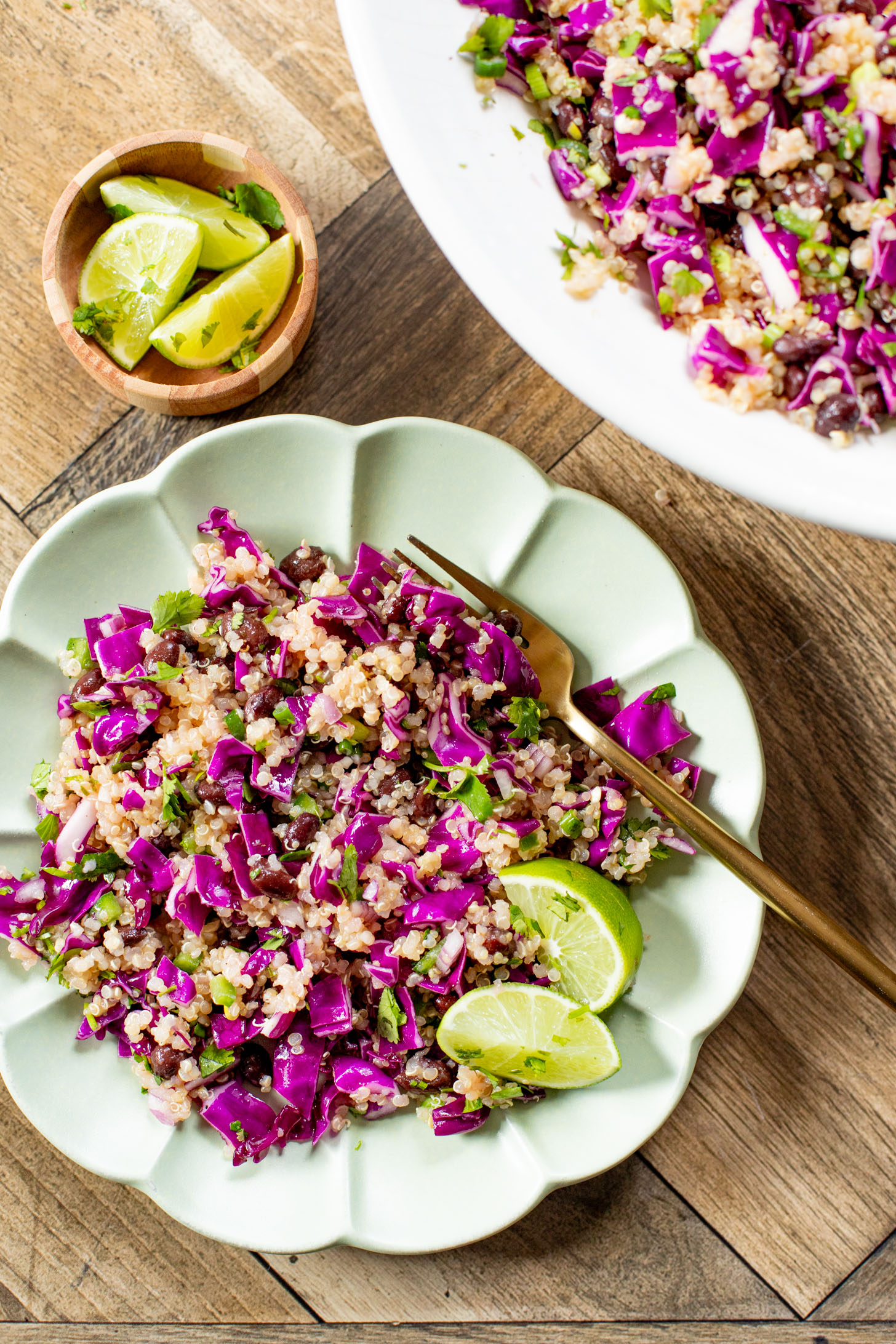 This Black Bean Quinoa Salad is filled with crunchy veggies, a light lime dressing, black beans and chilled quinoa. The perfect lunch or dinner | ThisSavoryVegan.com