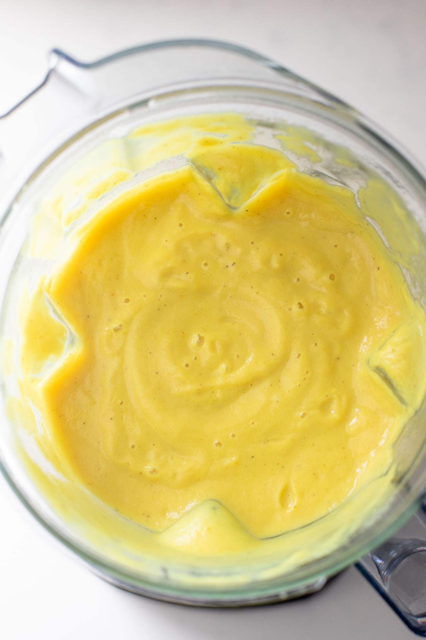 This Creamy Curried Cauliflower Soup is veggie-packed and dairy-free. A delicious, creamy vegan soup that is ready in less than an hour | ThisSavoryVegan.com