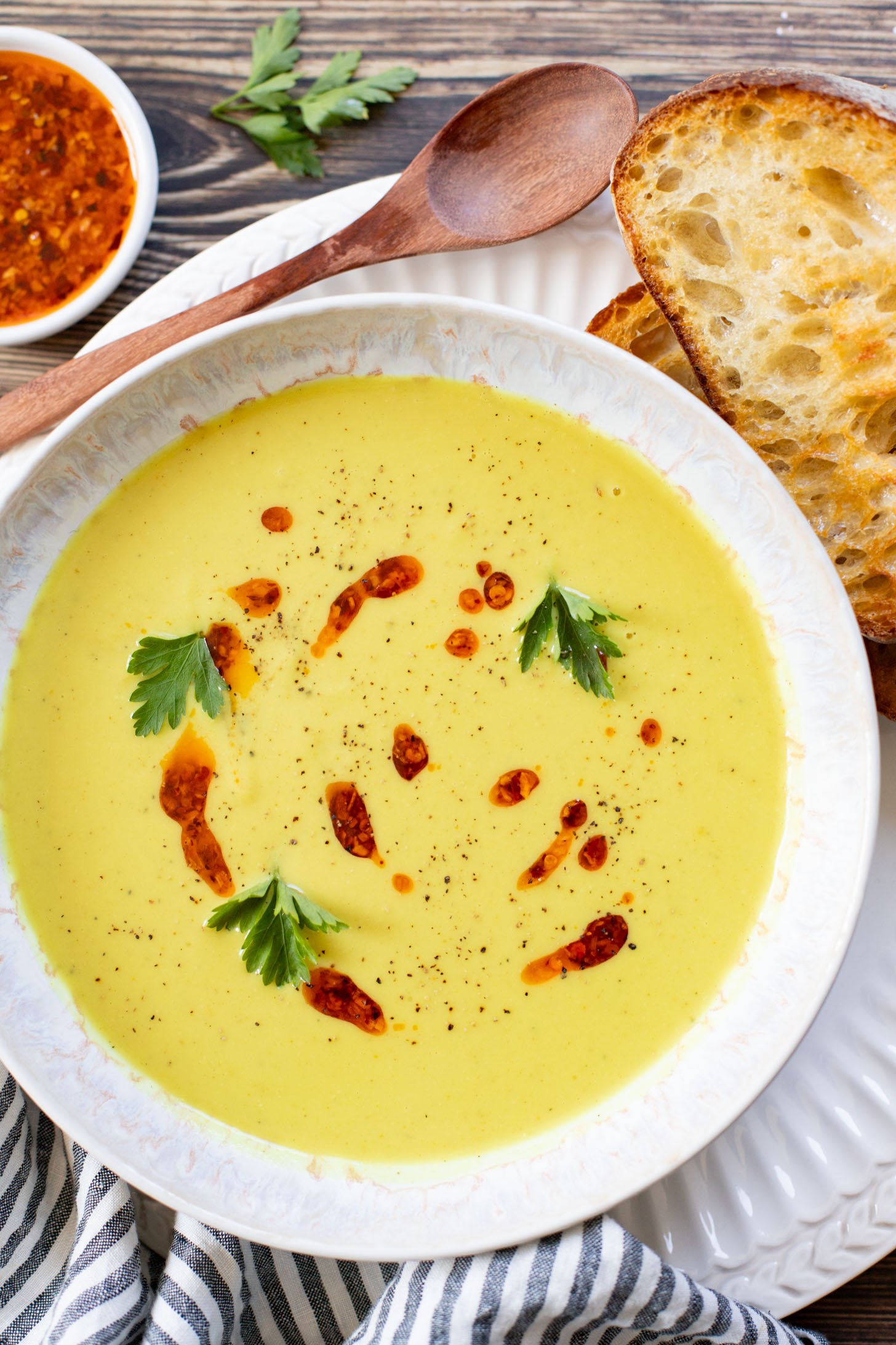 This Creamy Curried Cauliflower Soup is veggie-packed and dairy-free. A delicious, creamy vegan soup that is ready in less than an hour | ThisSavoryVegan.com