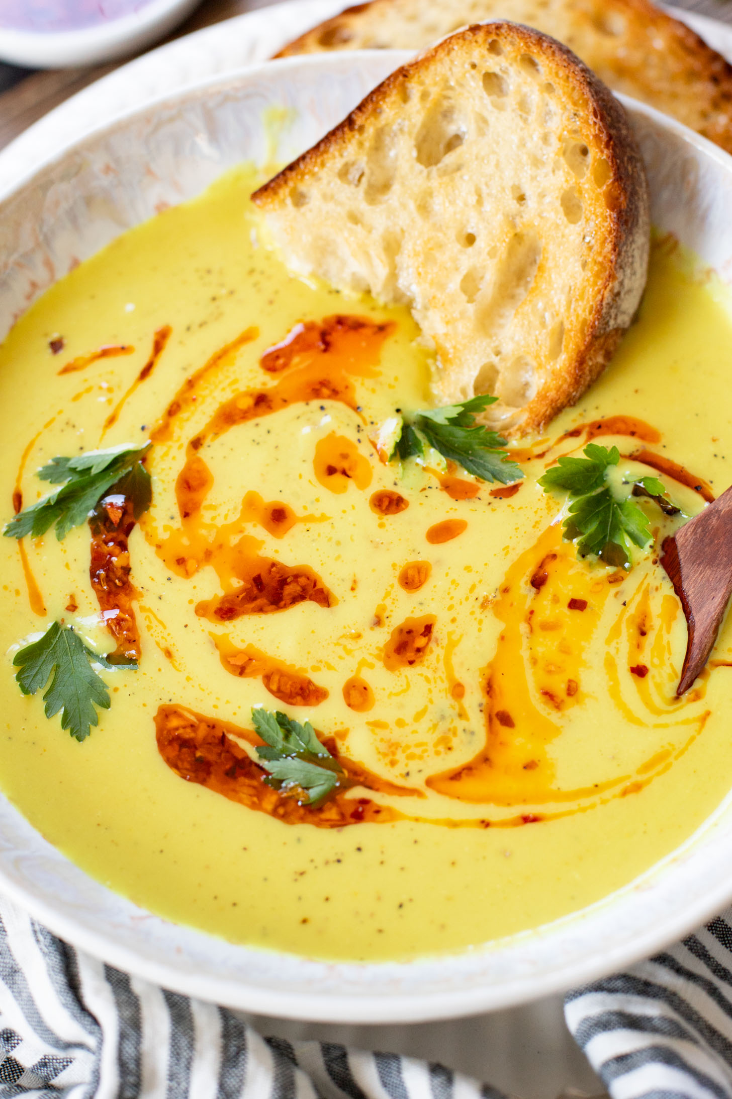 This Creamy Curried Cauliflower Soup is veggie-packed and dairy-free. A delicious, creamy vegan soup that is ready in less than an hour | ThisSavoryVegan.com