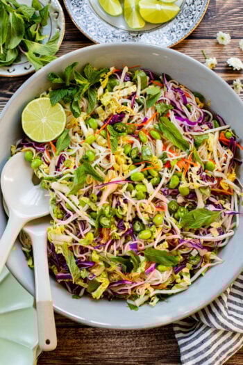 This Edamame Rice Noodle Salad is veggie (and protein) packed. Made with rice noodles and served with a sweet chili lime dressing | ThisSavoryVegan.com