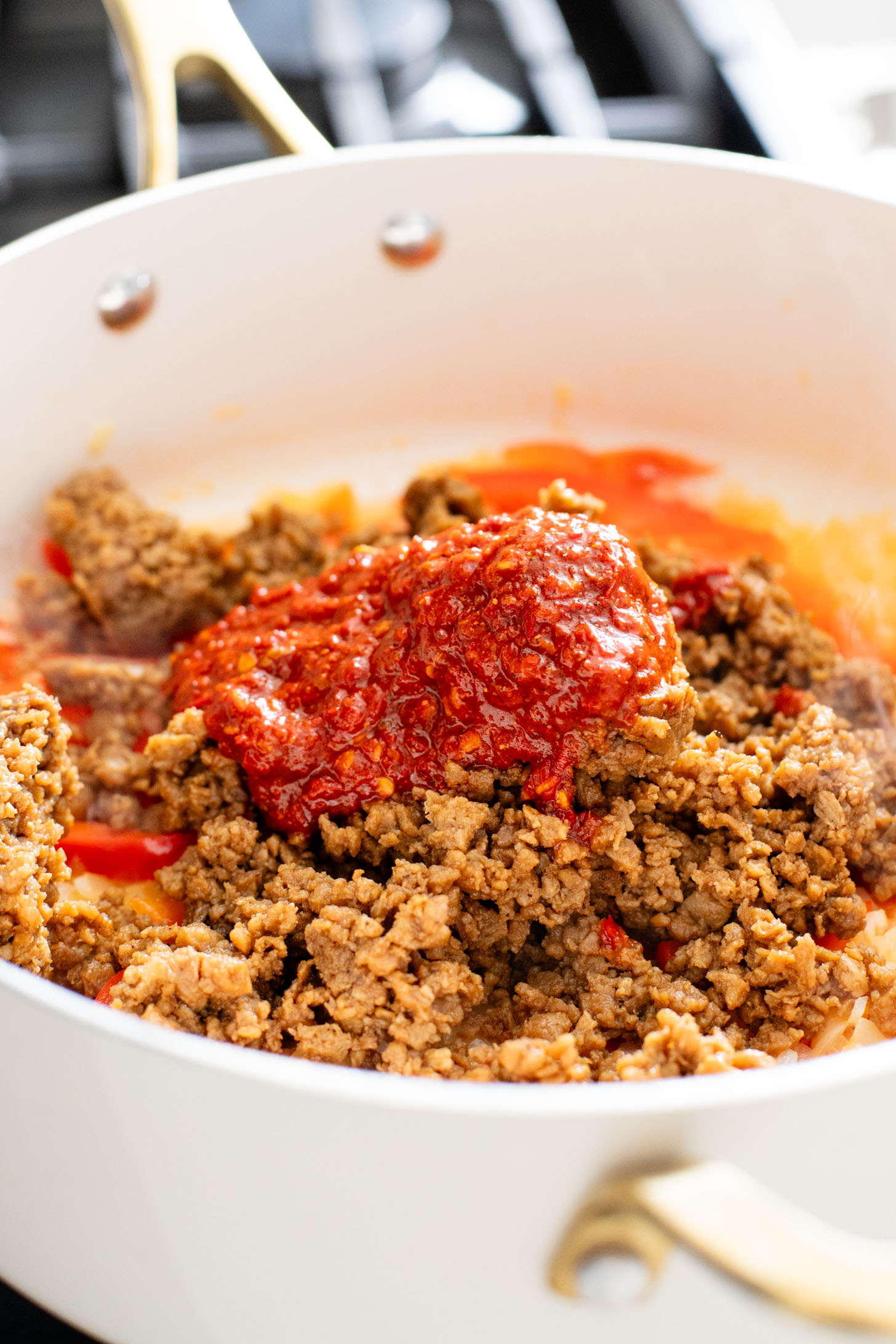 These Vegan Harissa Beef Couscous Bowls are layered with lemon couscous, hummus, veggies, "beef" crumbles and vegan feta sauce | ThisSavoryVegan.com