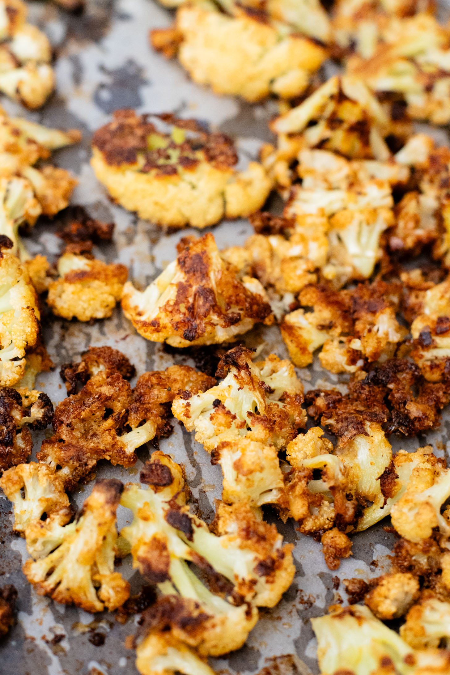 This Parmesan Cauliflower & Lentil Salad is 100% vegan. The cauliflower is coated in vegan parmesan & roasted until crispy. Served over a fresh lentil salad | ThisSavoryVegan.com