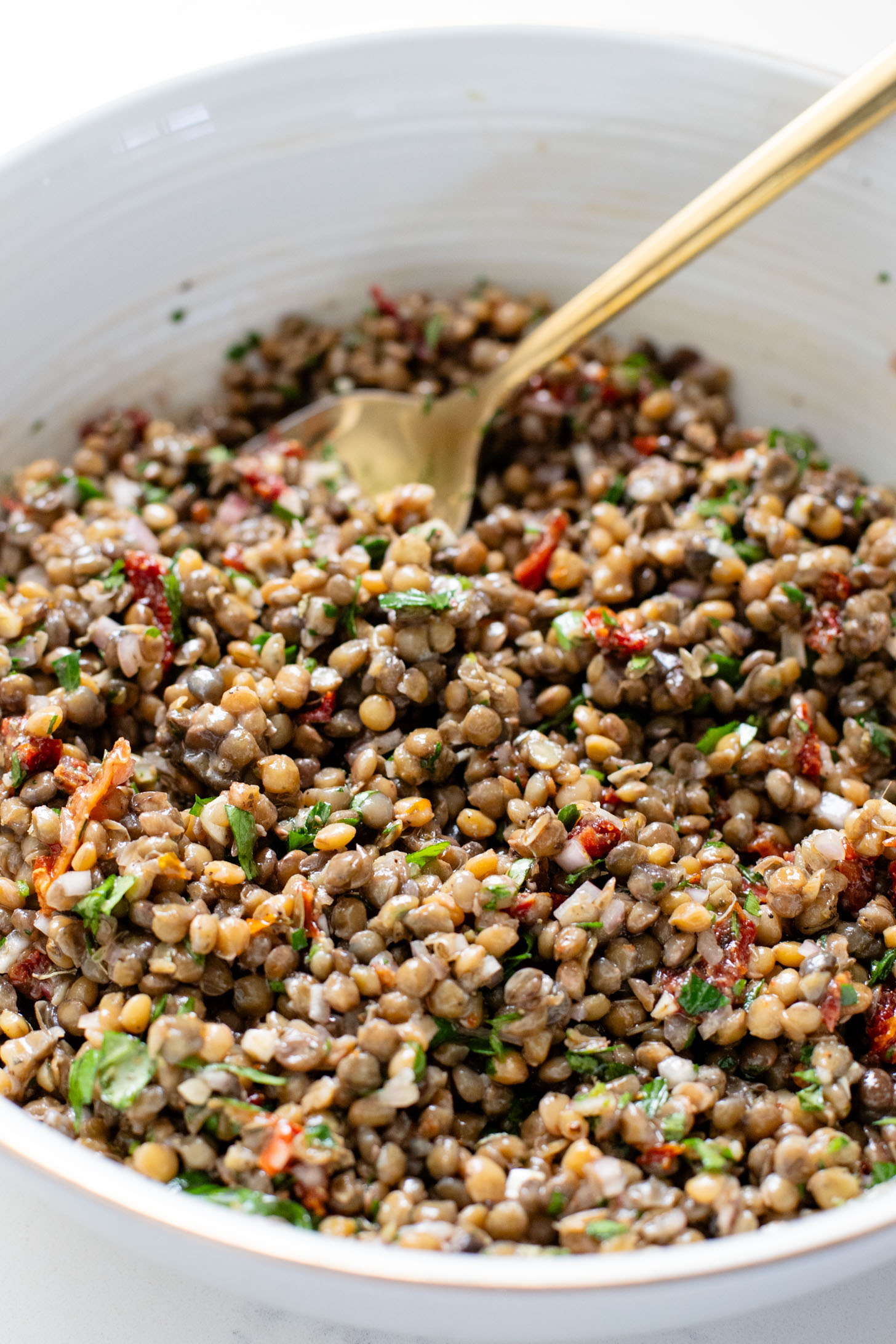This Parmesan Cauliflower & Lentil Salad is 100% vegan. The cauliflower is coated in vegan parmesan & roasted until crispy. Served over a fresh lentil salad | ThisSavoryVegan.com