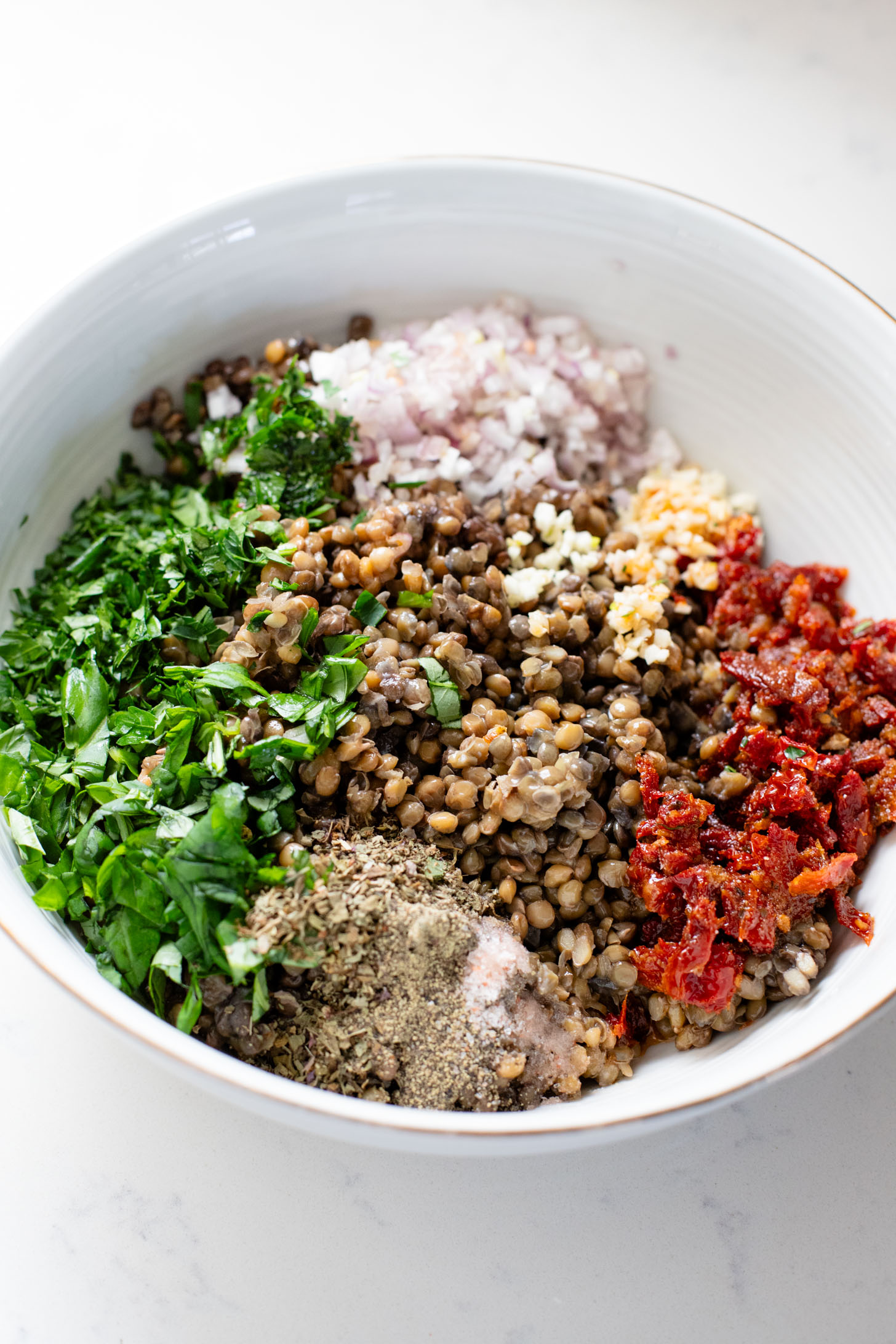 This Parmesan Cauliflower & Lentil Salad is 100% vegan. The cauliflower is coated in vegan parmesan & roasted until crispy. Served over a fresh lentil salad | ThisSavoryVegan.com