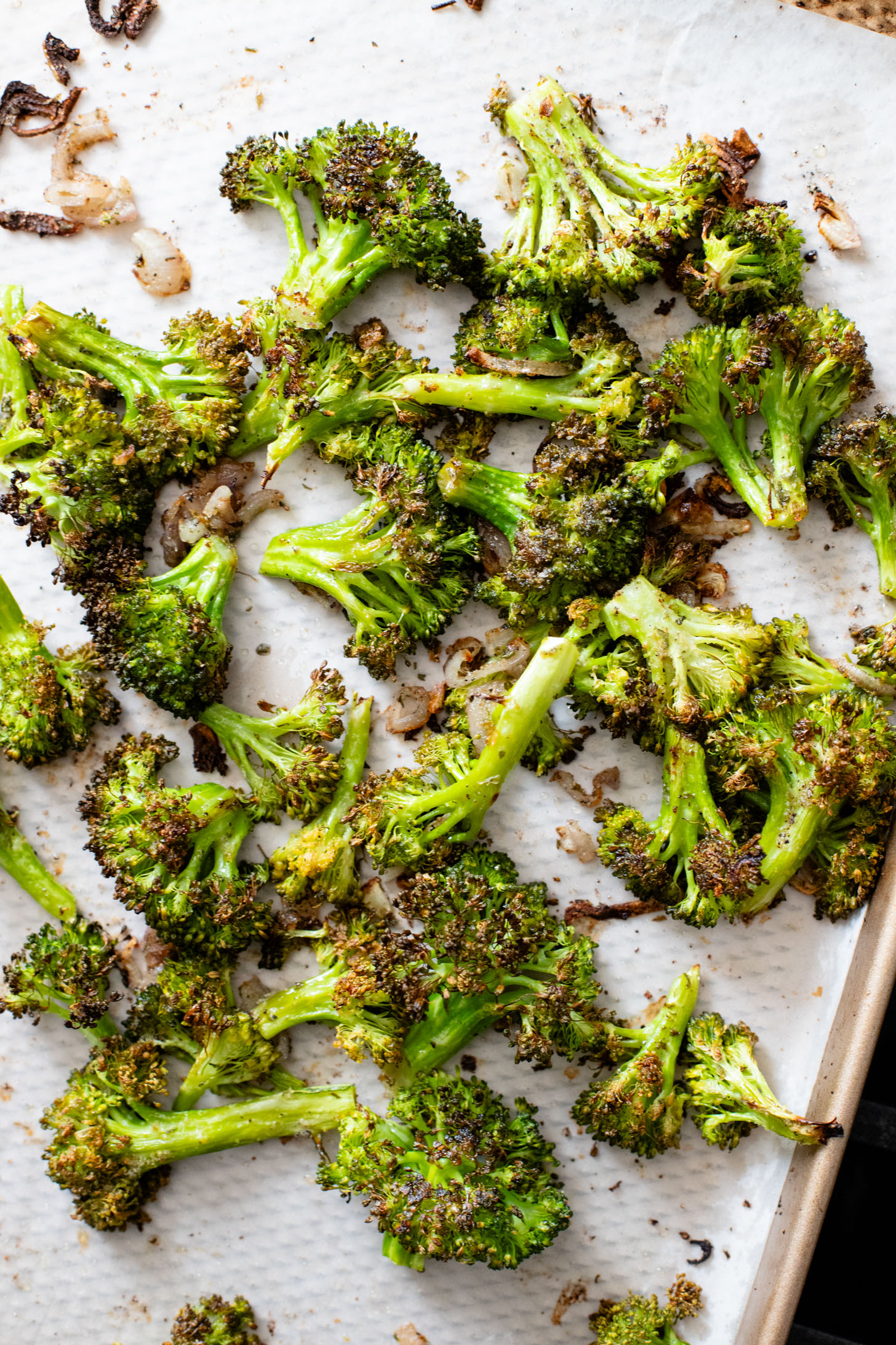This Roasted Broccoli Salad is layered with crispy shallots & broccoli, garlic croutons, sunflower seeds and lemon tahini dressing | ThisSavoryVegan.com