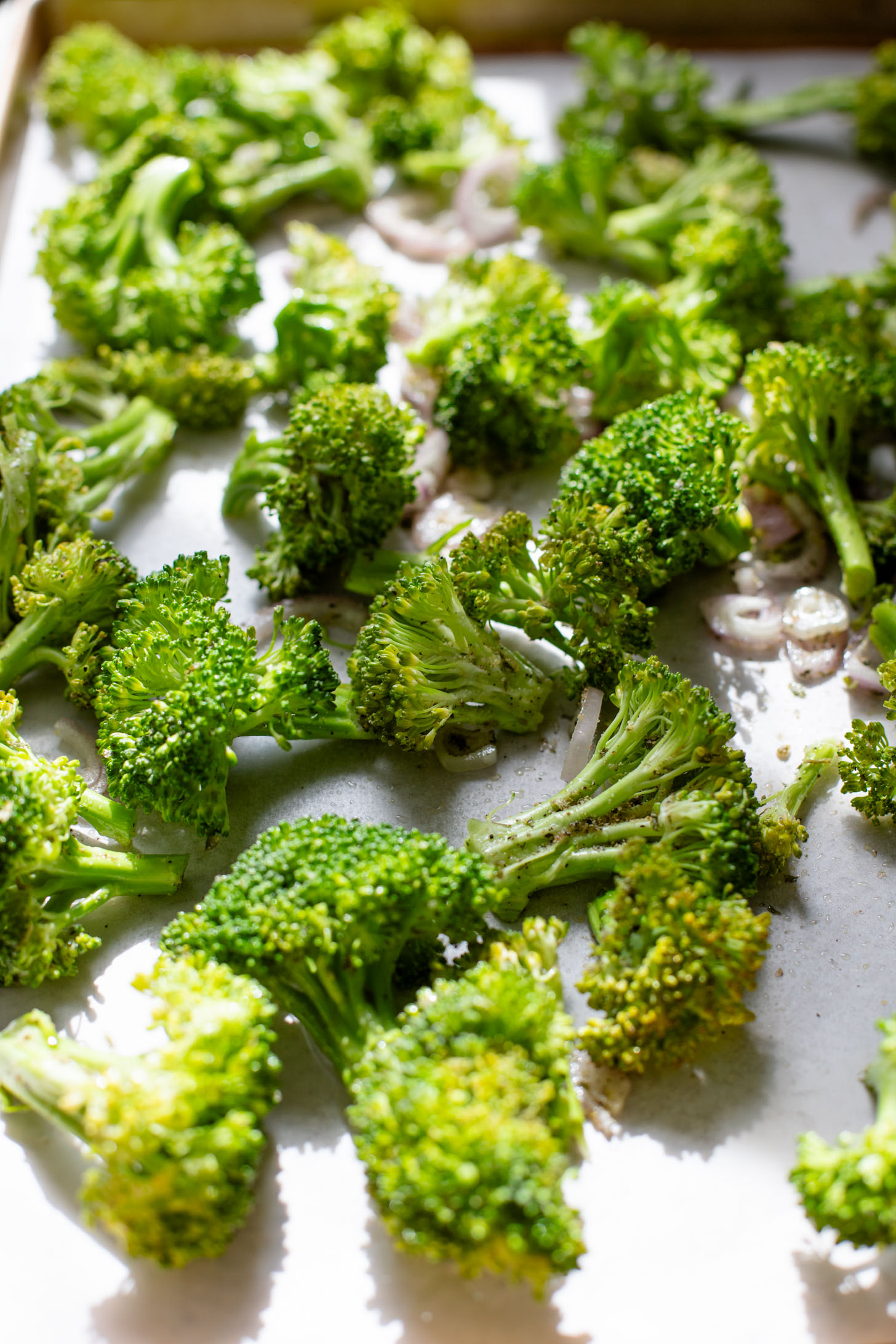 This Roasted Broccoli Salad is layered with crispy shallots & broccoli, garlic croutons, sunflower seeds and lemon tahini dressing | ThisSavoryVegan.com