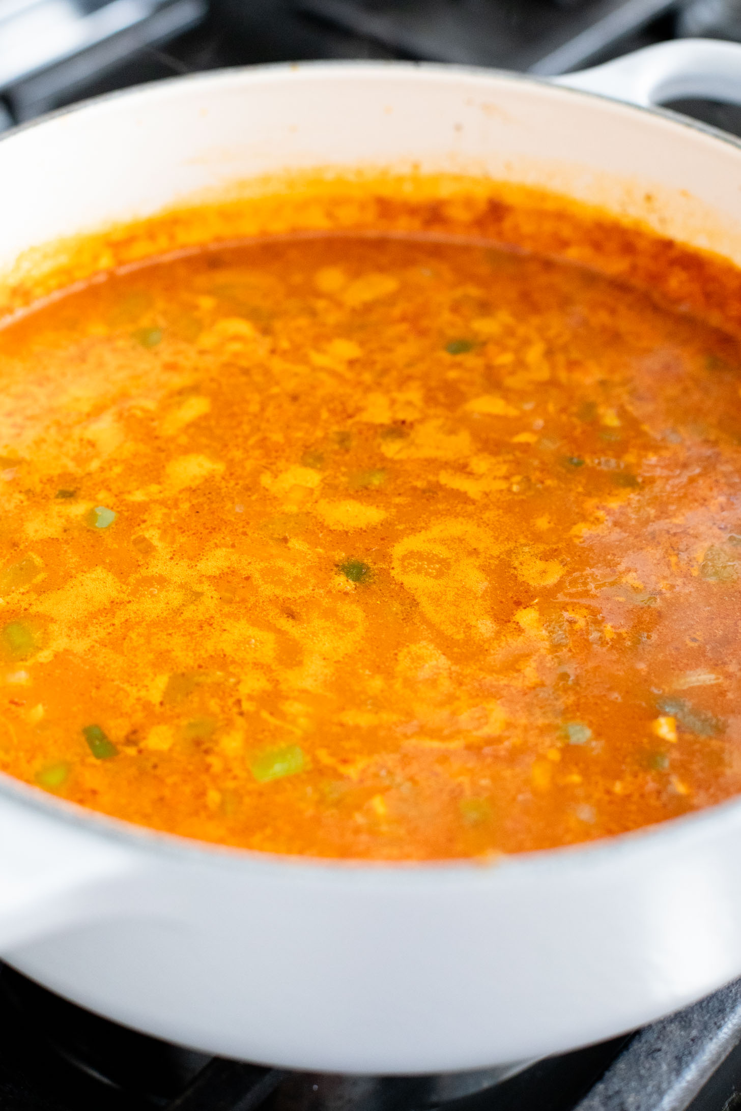 This Roasted Cauliflower Tortilla Soup is cozy and veggie packed! The perfect bowl of soup to warm up with on a cold day | ThisSavoryVegan.com