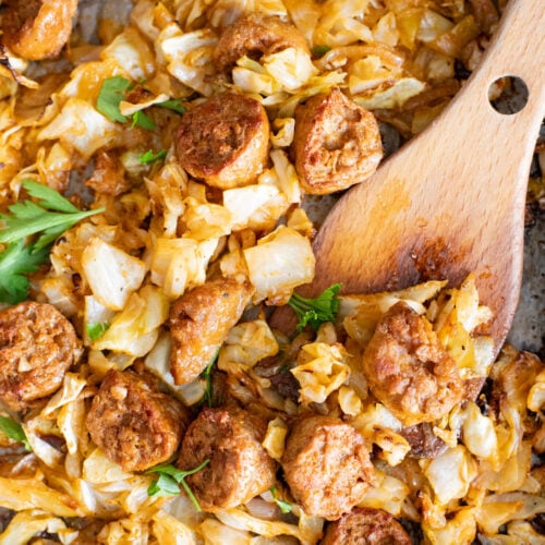 This Sheet Pan Vegan Sausage & Cabbage is an easy, low carb, vegan dinner. Ready in less than an hour and packed with flavor | ThisSavoryVegan.com