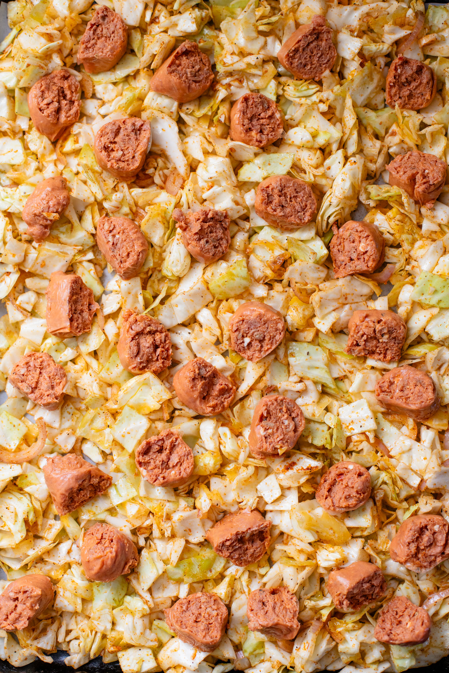 This Sheet Pan Vegan Sausage & Cabbage is an easy, low carb, vegan dinner. Ready in less than an hour and packed with flavor | ThisSavoryVegan.com