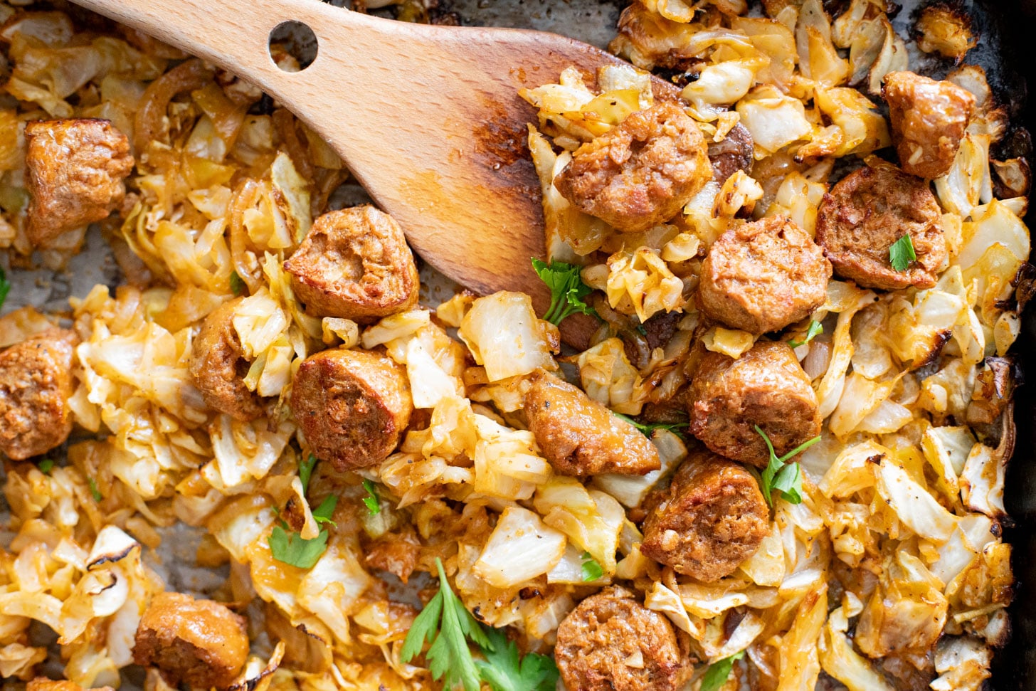 This Sheet Pan Vegan Sausage & Cabbage is an easy, low carb, vegan dinner. Ready in less than an hour and packed with flavor | ThisSavoryVegan.com