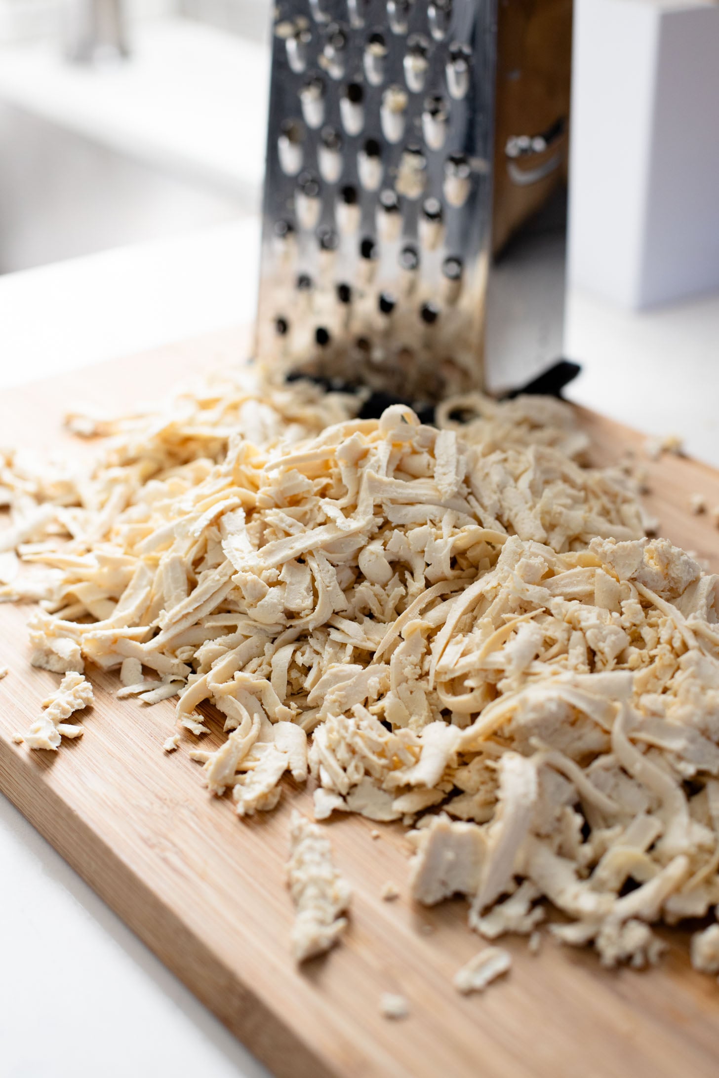 These Shredded Tofu Burrito Bowls are high in protein and veggie-packed! Crispy shredded tofu, black beans, veggies & salsa verde yogurt sauce | ThisSavoryVegan.com