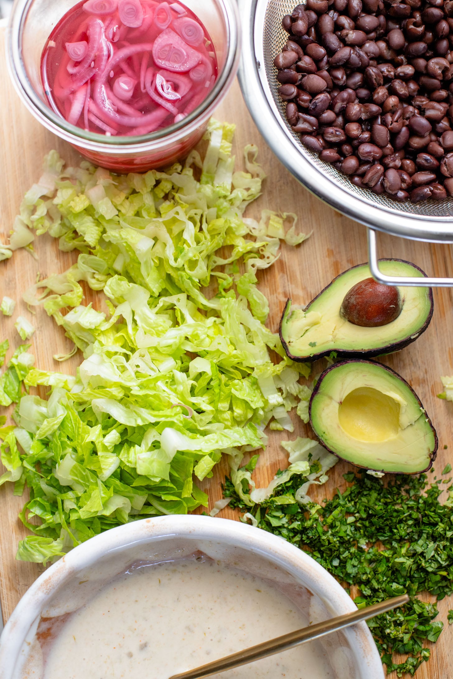 These Shredded Tofu Burrito Bowls are high in protein and veggie-packed! Crispy shredded tofu, black beans, veggies & salsa verde yogurt sauce | ThisSavoryVegan.com