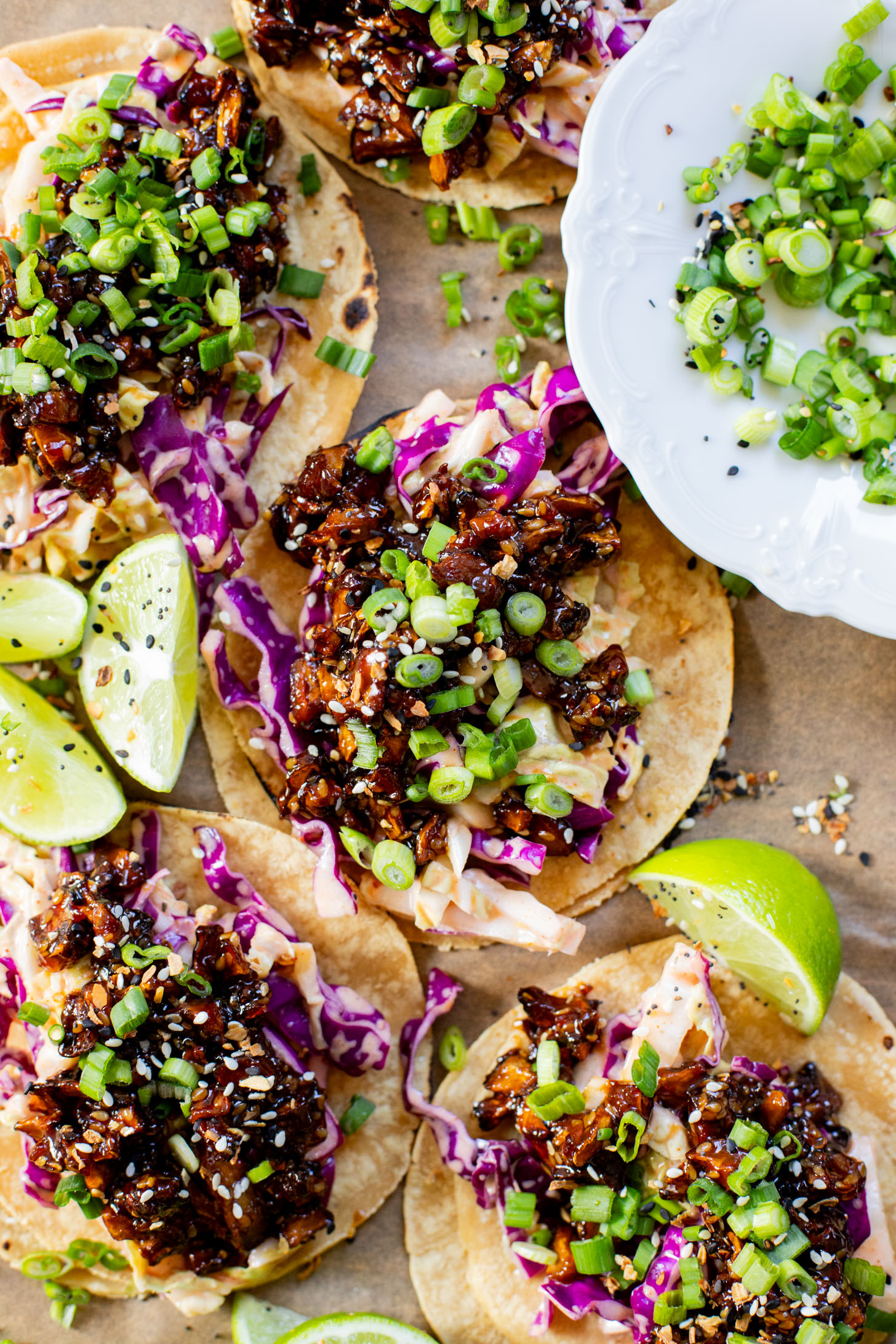These Soyaki Mushroom Street Tacos are simple, delicious & vegan! Crispy mushrooms tossed in soyaki sauce & spicy slaw on mini corn tortillas | ThisSavoryVegan.com