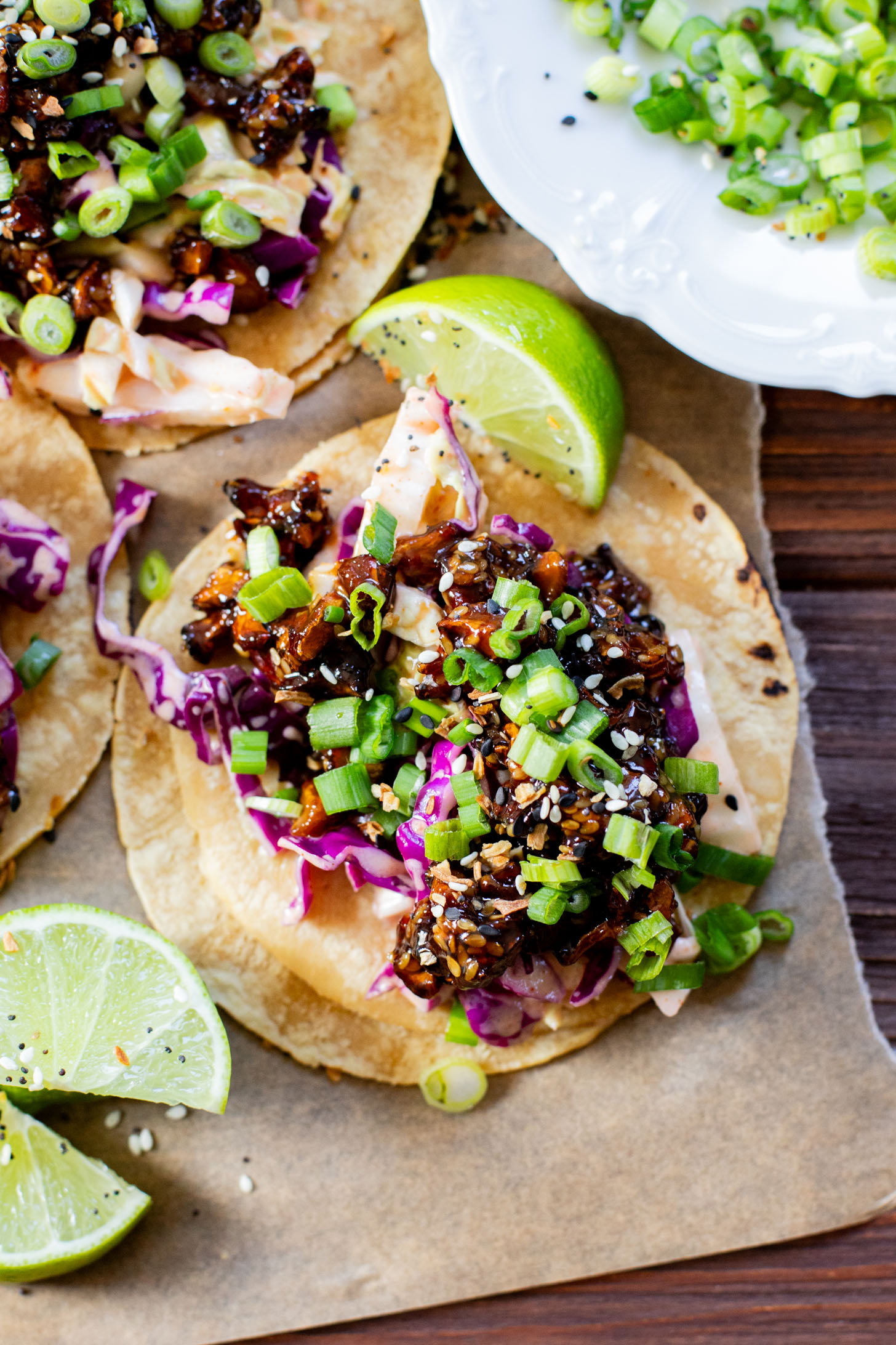 These Soyaki Mushroom Street Tacos are simple, delicious & vegan! Crispy mushrooms tossed in soyaki sauce & spicy slaw on mini corn tortillas | ThisSavoryVegan.com