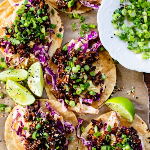 These Soyaki Mushroom Street Tacos are simple, delicious & vegan! Crispy mushrooms tossed in soyaki sauce & spicy slaw on mini corn tortillas | ThisSavoryVegan.com