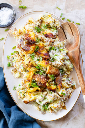 This Vegan Smashed Potato Salad is made with Yukon gold potatoes that are crisped up in the oven and tossed in a dairy-free dressing | ThisSavoryVegan.com